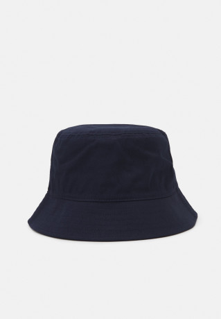 Tommy Hilfiger FLAG BUCKET HAT Hat desert sky FLAG BUCKET HAT Шяпа небо пустыни