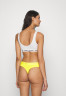 Tommy Hilfiger THONG Thong vivid yellow ТОНГ стринги ярко-желтый