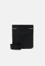 Tommy Hilfiger CENTRAL MINI CROSSOVER UNISEX Across body bag black CENTRAL MINI CROSSOVER UNISEX Сумка через плечо черный