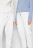 Tommy Hilfiger ROUNDALL GRAPHIC SWEATPANT UNISEX Tracksuit bottoms white СПОРТИВНЫЕ БРЮКИ ROUNDALL GRAPHIC UNISEX Спортивные штаны белый