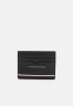 Tommy Hilfiger CENTRAL HOLDER UNISEX Wallet black ЦЕНТРАЛЬНЫЙ ДЕРЖАТЕЛЬ УНИСЕКС Бумажник черный