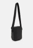 Tommy Hilfiger ESSENTIAL MINI REPORTER UNISEX Across body bag black ESSENTIAL MINI REPORTER UNISEX Сумка через плечо черный