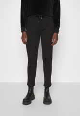 Tommy Hilfiger TAPERED TERRY TRIM Tracksuit bottoms black TAPERED TERRY TRIM Спортивные брюки черный