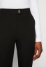Tommy Hilfiger SEASONAL FLARE PANT Trousers black БРЮКИ SEASONAL FLARE PANT Брюки черный