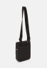 Tommy Hilfiger ELEVATED MINI CROSSOVER UNISEX Across body bag black ELEVATED MINI CROSSOVER UNISEX Сумка через плечо черный