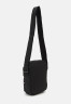 Tommy Hilfiger SKYLINE MINI REPORTER UNISEX Across body bag black SKYLINE MINI REPORTER UNISEX Сумка через плечо черный