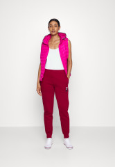 Tommy Hilfiger TAPERED MONOGRAM SWEATPANTS Tracksuit bottoms rouge СПОРТИВНЫЕ БРЮКИ TAPERED MONOGRAM Спортивные штаны румяна