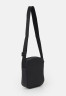 Tommy Hilfiger ESSENTIAL MINI REPORTER UNISEX Across body bag black ESSENTIAL MINI REPORTER UNISEX Сумка через плечо черный