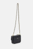 Tommy Hilfiger HERO TURNLOCK MINI CROSSOVER Across body bag space blue HERO TURNLOCK MINI CROSSOVER Сумка через плечо космический синий