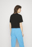 Tommy Hilfiger ESSENTIALS RELAXED CROPPED TEE Sports T-shirt black УКОРОЧЕННАЯ ФУТБОЛКА ESSENTIALS RELAXED Спортивная футболка черный