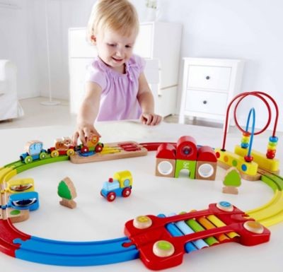 HAPE Regenbogen-Puzzle Eisenbahnset Набор радужных поездов-пазлов