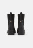 Tommy Hilfiger FEMININE SEASONAL UTILITY Platform ankle boots black FEMININE SEASONAL UTILITY Ботильоны на платформе черный