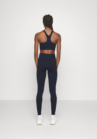 Tommy Hilfiger MID SORONA MIX BRA Medium support sports bra desert sky MID SORONA MIX BRA Спортивный бюстгальтер со средней поддержкой небо пустыни