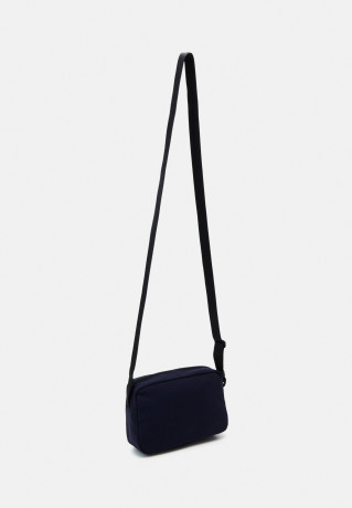 Tommy Hilfiger MODERN UTILITY REPORTER UNISEX Across body bag space blue MODERN UTILITY REPORTER UNISEX Сумка через плечо космический синий