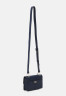 Tommy Hilfiger PUSHLOCK MINI CROSSOVER Across body bag space blue PUSHLOCK MINI CROSSOVER Сумка через плечо космический синий