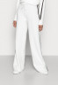 Tommy Hilfiger FLEX WIDE LEG PANT Tracksuit bottoms ecru FLEX WIDE LEG PANT Брюки от спортивного костюма экрю