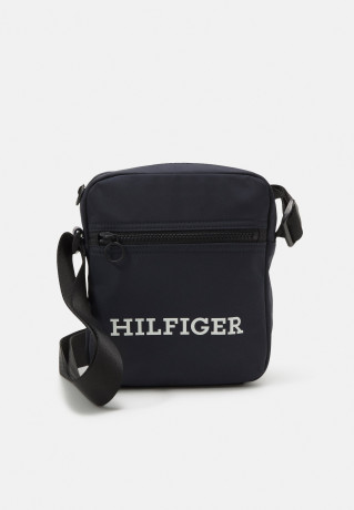 Tommy Hilfiger HILFIGER MINI REPORTER Across body bag space blue HILFIGER MINI REPORTER Сумка через плечо космический синий