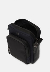 Tommy Hilfiger COMMUTER MINI REPORTER Across body bag space blue COMMUTER MINI REPORTER Сумка через плечо космический синий