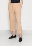 Tommy Hilfiger RELAXED LONG PANT Tracksuit bottoms beige RELAXED LONG PANT Спортивные штаны бежевый