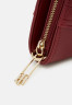 Tommy Hilfiger TIMELESS SMALL TOTE QUILTED Handbag rouge TIMELESS SMALL TOTE SQUILTED Сумка румяна