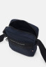 Tommy Hilfiger HORIZON MINI REPORTER UNISEX Across body bag space blue HORIZON MINI REPORTER UNISEX Сумка через плечо космический синий