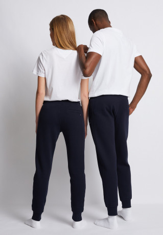 Tommy Hilfiger LOGO SWEATPANTS UNISEX Tracksuit bottoms desert sky СПОРТИВНЫЕ БРЮКИ С ЛОГОТИПОМ УНИСЕКС Спортивные штаны небо пустыни