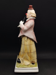 Музыкальная шкатулка винтажная Melody in Motion "Клон с флейтой", ручная роспись, бисквитный фарфор, 32 см, Германия, 1970-80гг.