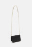 Tommy Hilfiger PLUSH MINI CROSSOVER Across body bag black PLUSH MINI CROSSOVER Сумка через плечо черный
