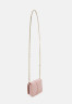 Tommy Hilfiger PLUSH MINI CROSSOVER Across body bag soothing pink PLUSH MINI CROSSOVER Сумка через плечо успокаивающий розовый