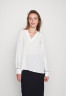 Tommy Hilfiger SOLID V NECK  Blouse ecru ТВЕРДАЯ БЛУЗА С V-ОБРАЗНЫМ ВЫРЕЗОМ экрю